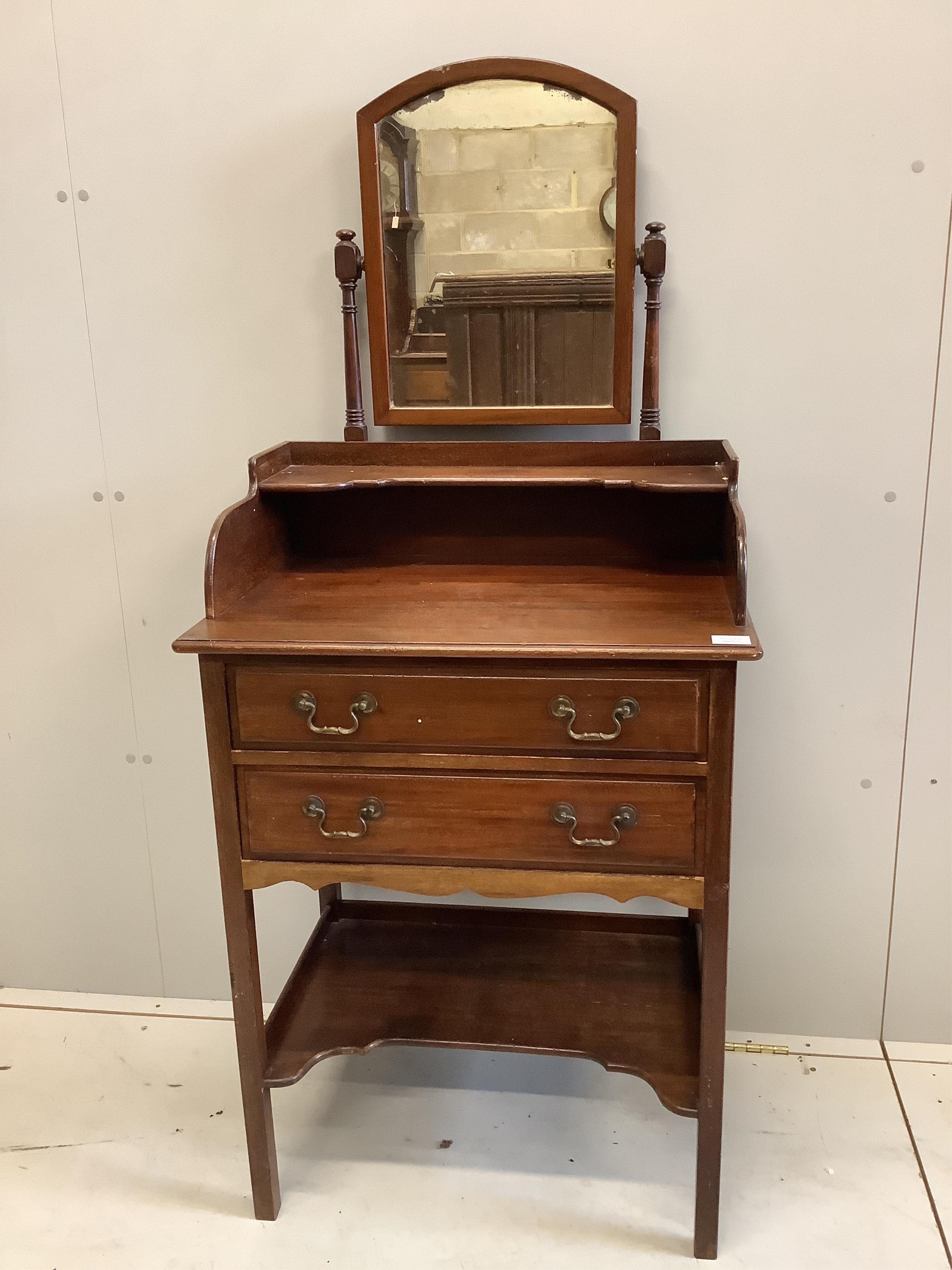 An Edwardian mahogany washstand, with mirror over, width 68cm, depth 45cm, height 144cm. Condition - fair